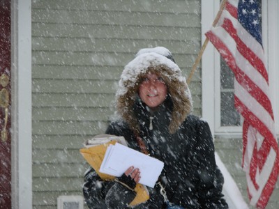 Erin Webb delivers mail in the snow.