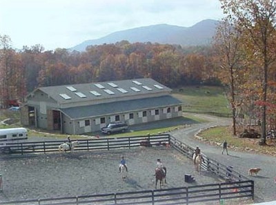 The outdoor riding ring and the barn that Roger built at Schunemunk Shadow stable.