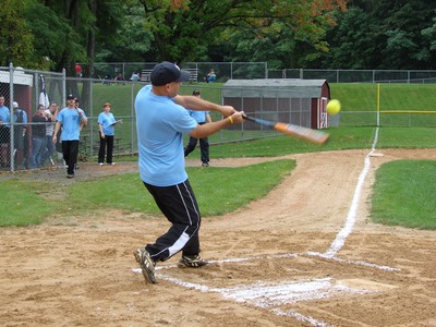 Officer Pena swings and sends the ball over the fence.