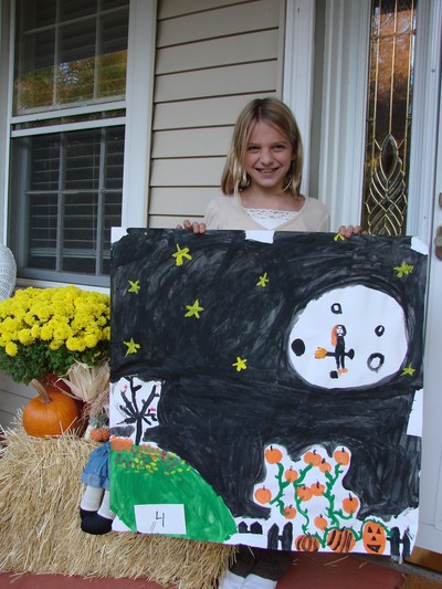 Emily Gaillard and her award-winning Halloween painting.
