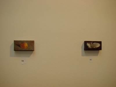 A lemon and a feather -- two works by artist Beth Kurtz of New York City.