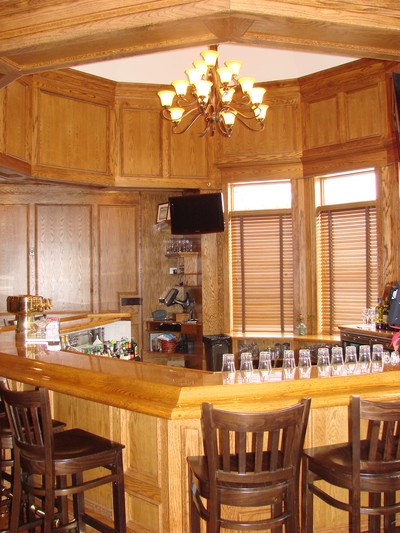 The clubhouse features a polished oak bar.