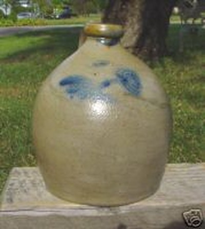 A stoneware jug signed by I.V. Machett