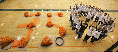 Student environmentalists created a living sculpture in the shape of 350.