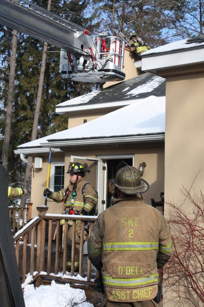 The company's ladder was stretched horizontally to give access to the chimney fire.