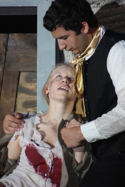 Marius comforts Eponine after she was injured in a brawl.
