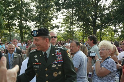 ﻿﻿General Petraeus marching in with the high school administrators and greeting individuals in the audience.  Photo by Maureen Moore.  