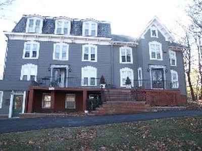 Half of this building has a mansard roof