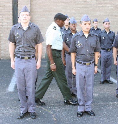 Staff Sgt. Bailey inspects the cadet posture at attention.