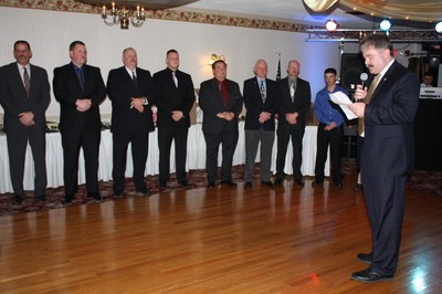 County legislator Kevin Hines swears in the fire department and company officers.
