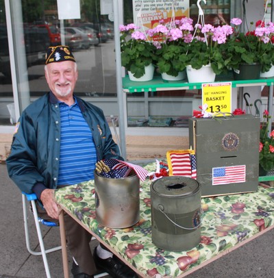 Ed Flynn, one of several members of American Legion Post 353 selling poppies this weekend.