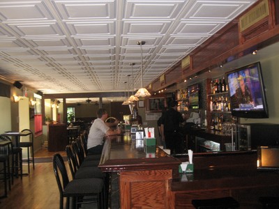 The polished bar occupies the space next to the dining room.