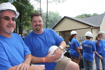 Dan and Andrew Mahoney take a break from wiring the house for security, audio and home theater.