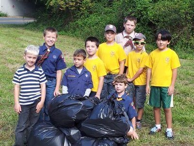 Photo by Arlene Roberts. Cub Scouts from Pack 20 clean up park.