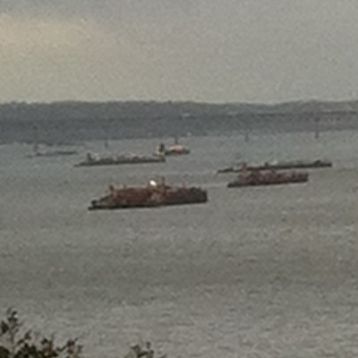 Photo by Jim Lennon. Oceangoing ships and tankers lined up in the area of the Newburgh-Beacon Bridge so as to tide out Hurricane Sandy.