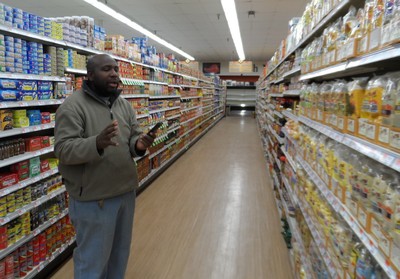 Photo by Jim Lennon. DeCicco's Store Manager Ainsley Brown gives a tour of the new store