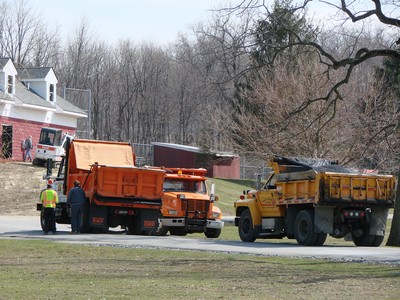 Trucks hauled in soil and asphalt