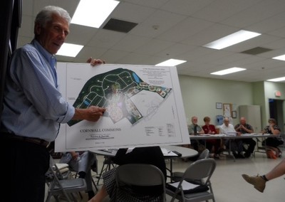 Photo by Jim Lennon. Cornwall Commons Developer Joe Amato, using expanded site display plan explains various aspects of the Development to attendees.