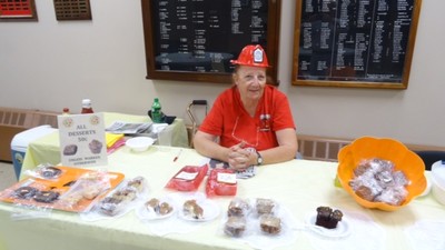 (Photo above by Jim Lennon) Joan Ivarson at the Desert Table at the yearly Harvest Soup & Dessert and Craft Festival at the Storm King Engine Company No.2 in Cornwall-on Hudson. 