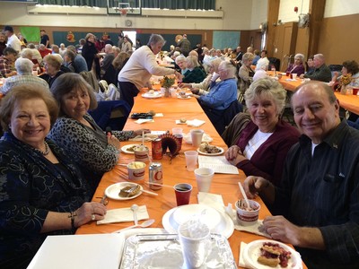 Mary Lou Corea, Fran Pirraglia, Susan Kenney and Anthony Pirraglia enjoy a turkey dinner at the annual Knights of Columbus dinner for seniors