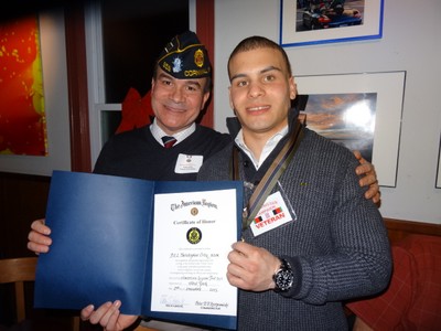 Photo by Jim Lennon. E5 Ortiz, with his father Rafael, holds American Legion Award at Painters on Friday January 02.