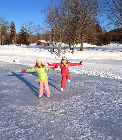 Photo by Lisa Sweeney. Maggie and Molly skating on Ring's Pond.