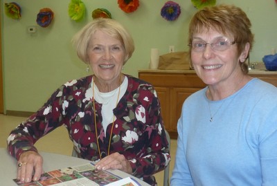 Cornwall Garden Club members Eileen Tulloch (L.) and Marge Krupa review plans for the Sands Ring Homestead herb garden. 