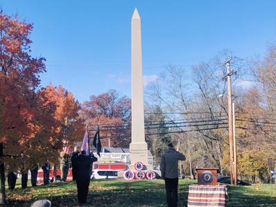 Photo by Casey Regenbaum. Salute the Memorial after the wreaths were placed. 