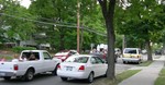 Cars go by in the afternoon