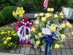 Flowers bedecked the memorial bench