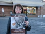 Anne Fulton with posters promoting the performances.