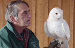 Bill Robinson and a snowy owl.