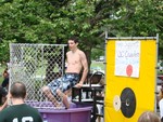 Members of the Orange County basketball team got dunked to raise money for a championship game in Arkansas.