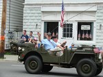 State senator Bill Larkin passed by in an old Army jeep.