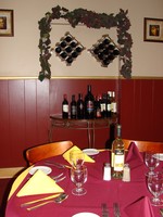 The dining room continues the Spanish-style decor.