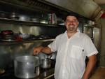 Francisco Sierra shows off his kitchen.