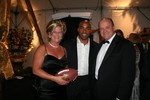 Tiki Barber (center) with Eileen and James Taylor.