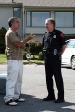 Actor Titus Welliver speaks with police chief Charles Williams.