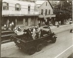 In a photo from the book, an army truck on parade on Main Street passes the post office, now Smitchger Realty.