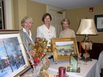 Patricia Affron, Susan Najork and Mary Vance Duggan with some of the items available in the silent auction.