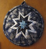 Learn to make a fabric folded star.