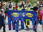 The scout troops each carried colorful handmade banners.
