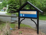 This sign on Bayview Avenue marks the entrance to the Esty and Hellie Stowell Trailhead.