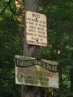 The old park sign was covered in mold.