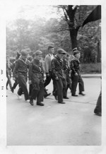 Cub Pack marching.  Front row (left to right): George Kane, Roy Barley, Donald Wall and Chip Hoffman