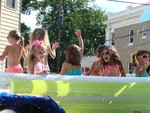 The girls had a pool party on the Madison Avenue float.