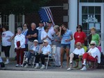 Folks gathered in the village square to watch the parade go by.