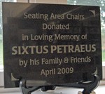 A plaque memorializing Sixtus Petreaus was installed near the reading chairs.