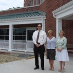 Hospital officials Robert Ross, Sue Sullivan and Judi Stokes outside the new cancer center.