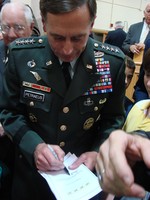 Crowds surrounded the general after his speech, asking for his autograph.